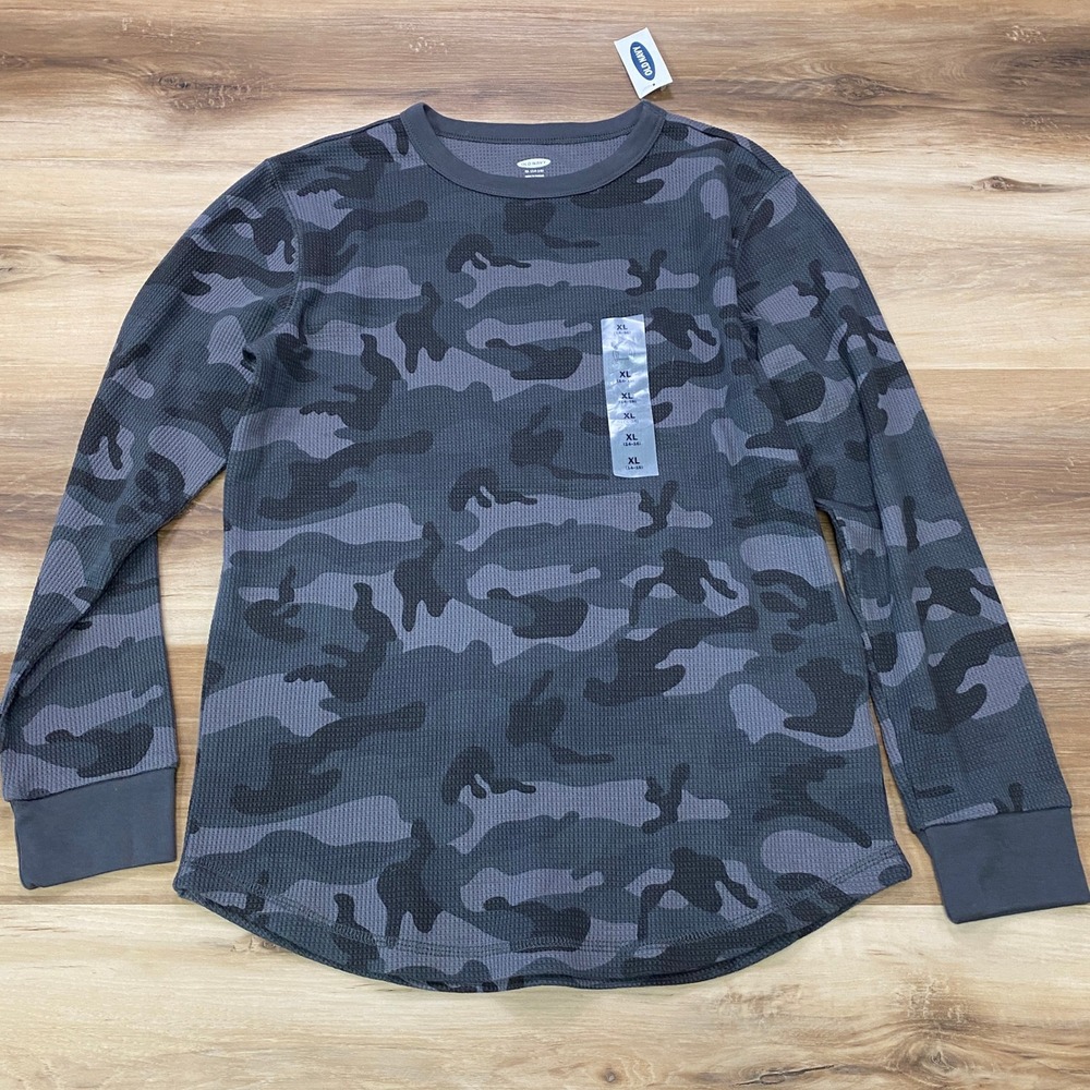 Light blue ink marks on back or shirt.